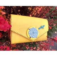 Handmade Yellow Leather Bag with a Blue and Yellow Lollypop Carmenittta